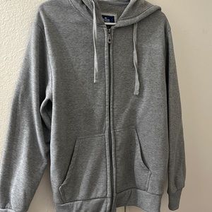 This is a regular Grey Zip Up sweater.